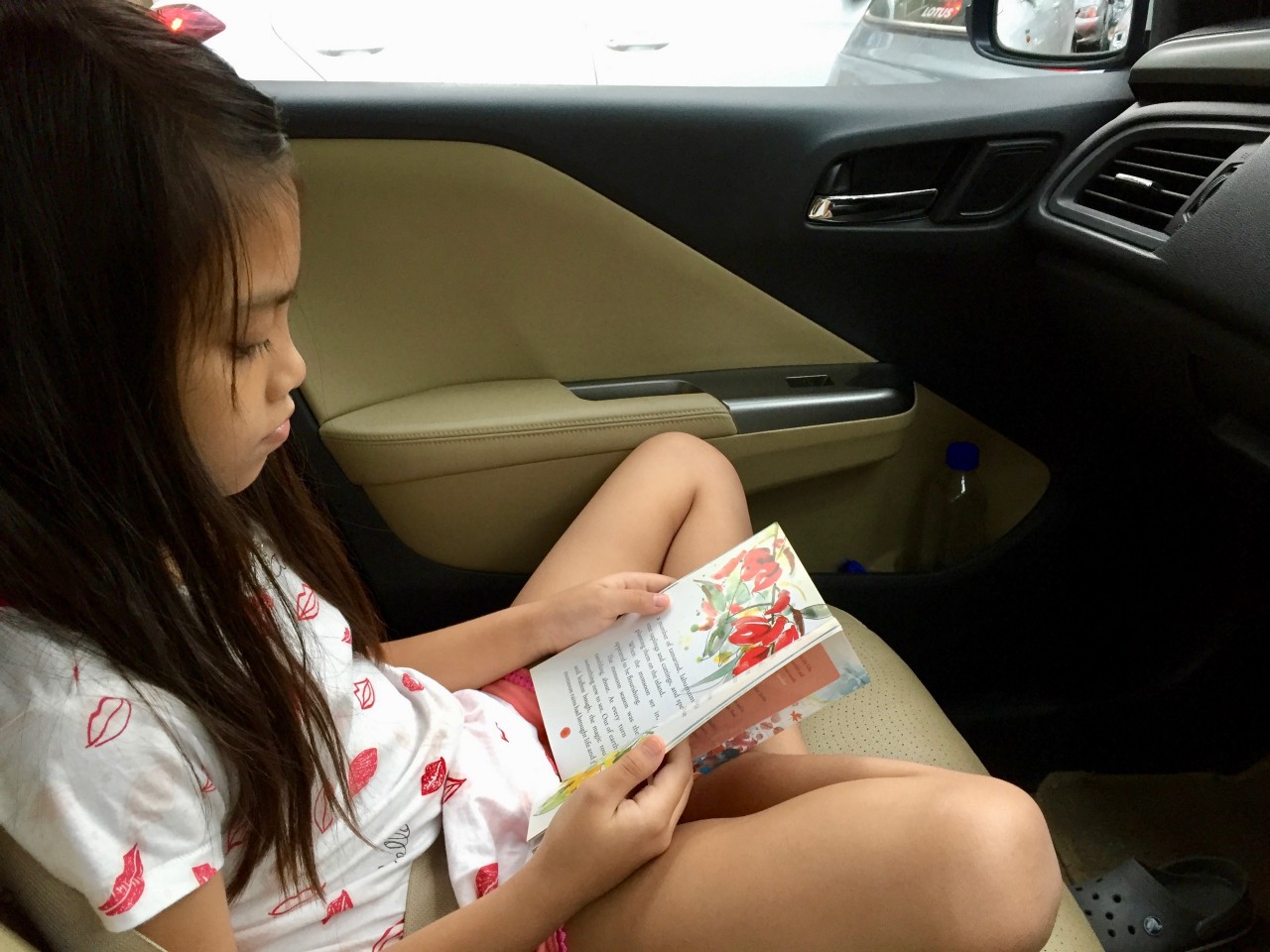 Laaija reads in the car)